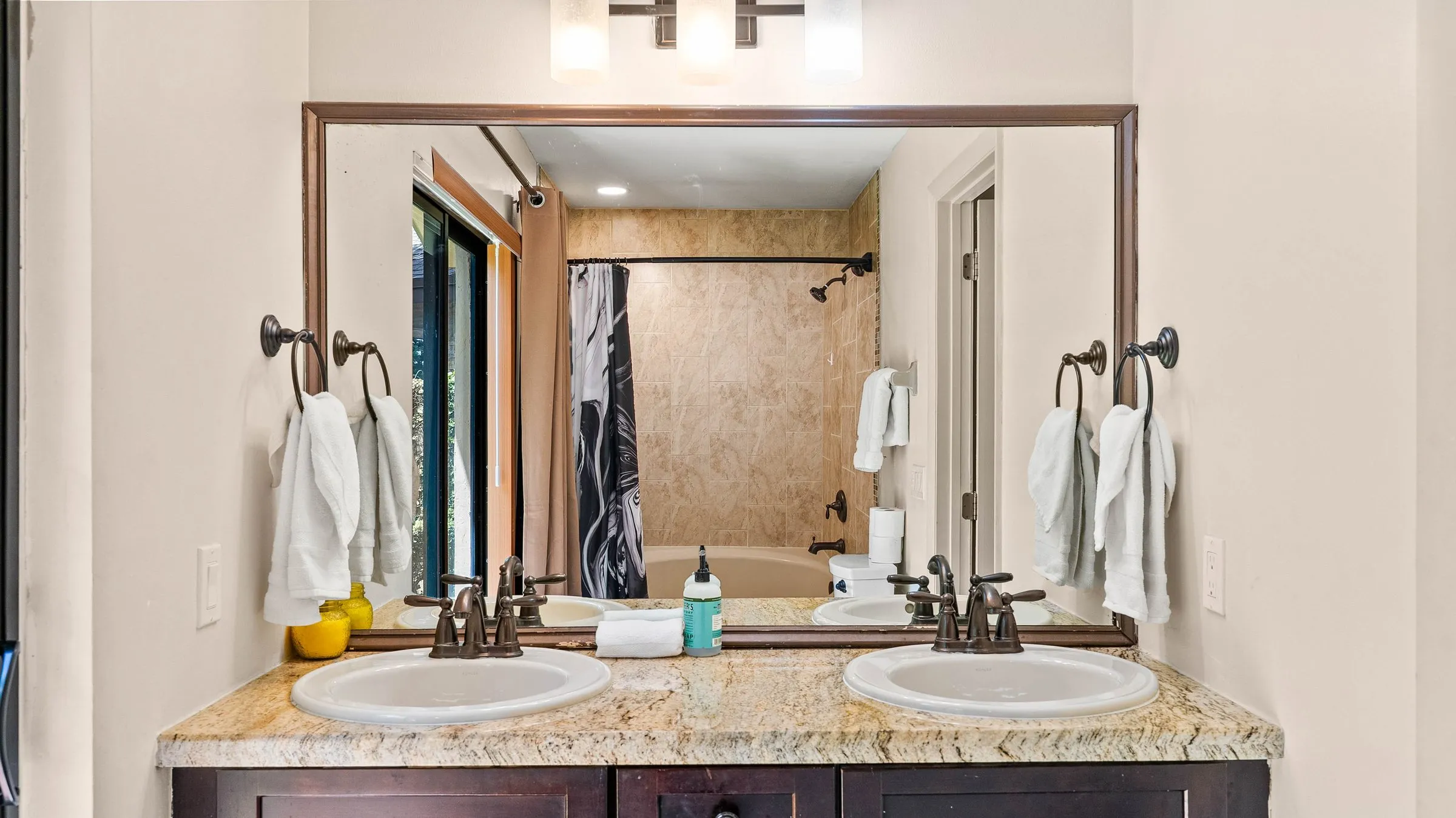 Double vanity and large mirror in the Master Suite bathroom