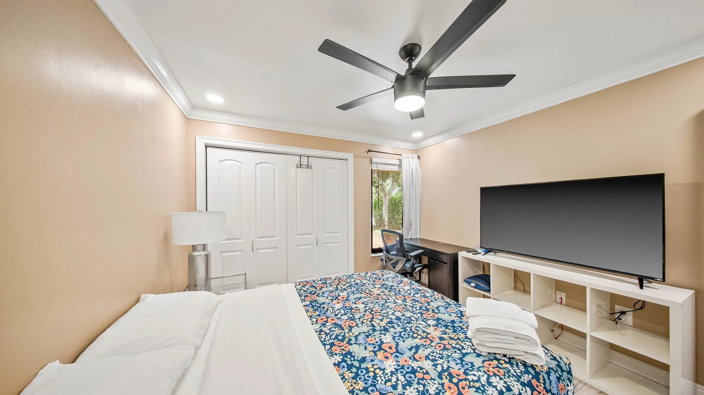 Queen bed with floral bedding
